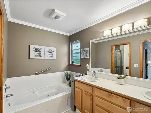 2 sinks, big mirror, soaker tub to relax and unwind.