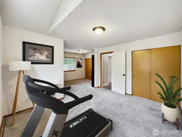 This shows how a wall could be added to make this a 5th bedroom or keep it as one large room.  Virtually staged.