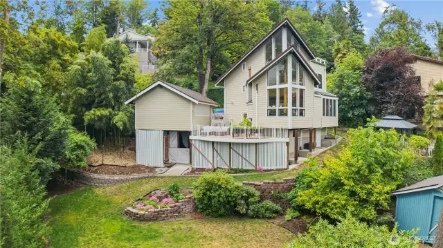 Lovely professionally planned backyard. Don't forget the covered golf driving room under the garage.