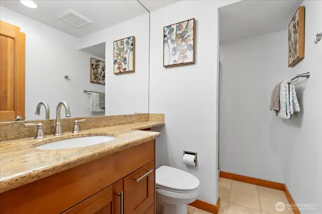 Powder Room with shower. Wonderful wall mirror with extended granite counter