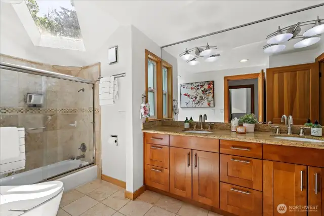 Enjoy the counter space and lovely wall mirror. Travertine Marble flooring throughout