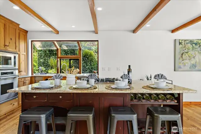 Enjoy the comfortable kitchen with only the best appliances. Dacor, Subzero, Viking to prepare daily meals like a chef. Solarium windows looking out at the sink.