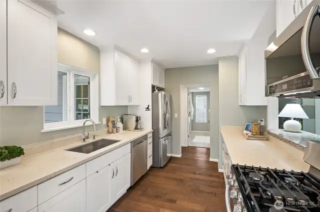 Stainless steel appliances, gas stove, and beautiful Quartz countertops.