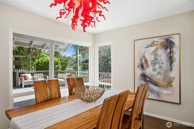 A bright and welcoming space with a stunning custom-blown glass chandelier and peek-a-boo lake views.