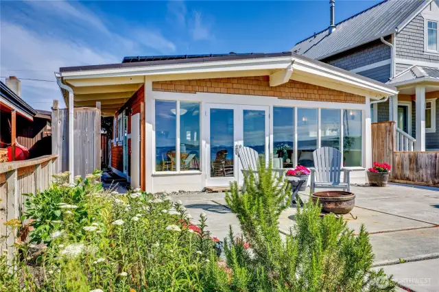 The home is a wall of windows to maximize the light and view.