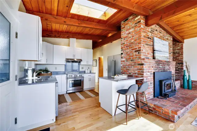 Kitchen features quartz counters and shaker style cabinetry with soft closers.