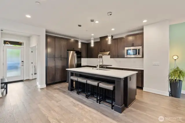 Any chef will enjoy cooking in the high-end kitchen with an oversized island.