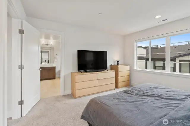 Experience comfort and serenity in your spacious bedroom.