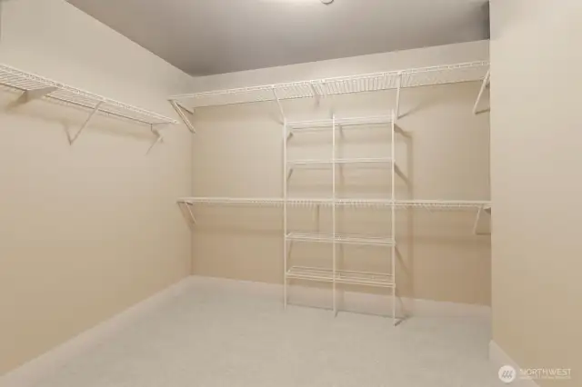 Any wardrobe will easily be accommodated in this oversized, walk in closet.