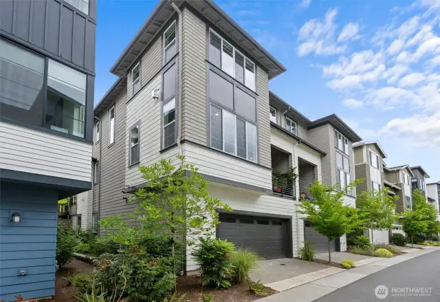 With convenient backside garage access, this townhome offers seamless entry and exit for effortless living.