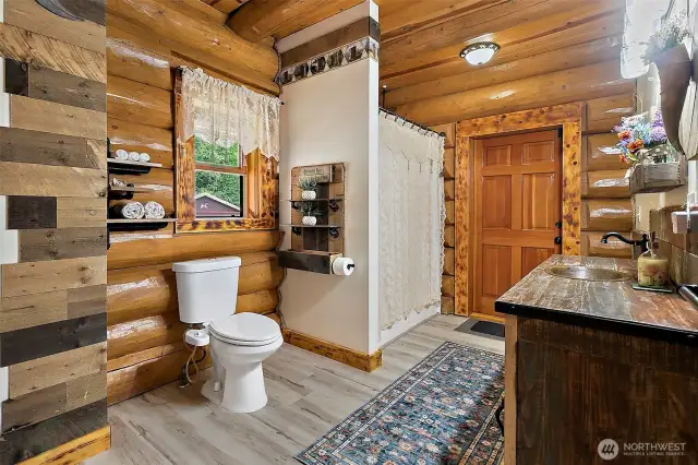 Full bath with outside door to courtyard, pool, shop, used like a mudroom.