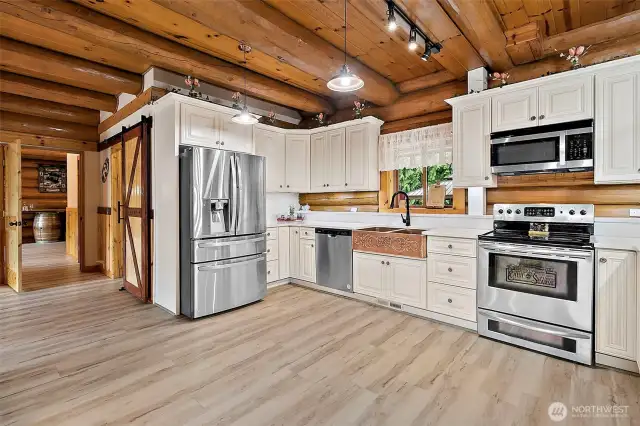 Walkin pantry to your right with the barn door.