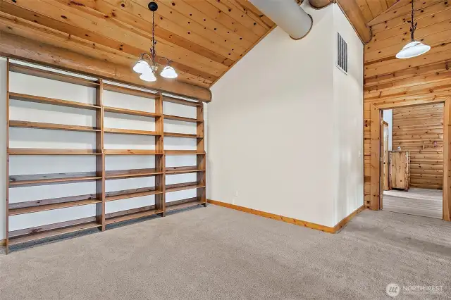 This beautiful loft awaits when you reach the second story landing. Primary to the right.