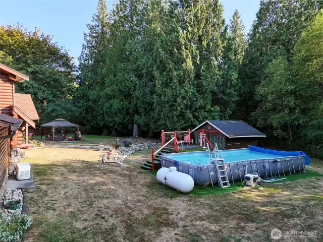 Generator stays, 2 propane tanks on property.
