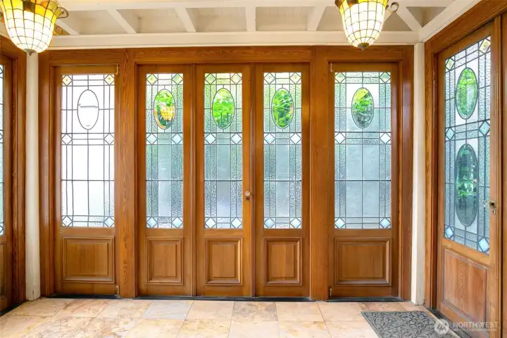 Sunroom off the kitchen has doors salvaged from a French hotel; this is a very cool feeling space.