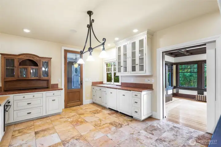 Spacious kitchen is the center of the home; between the formal dining, informal family room, directly from the entrance or outside through the sunroom.