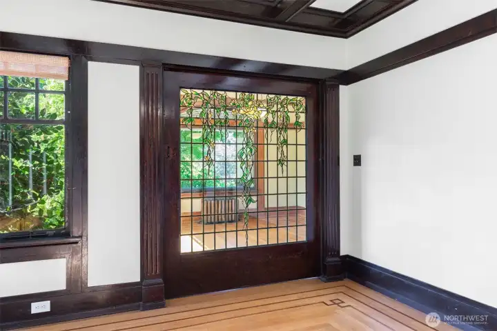 Family room has amazing pocket doors on both sides; like pieces of art.