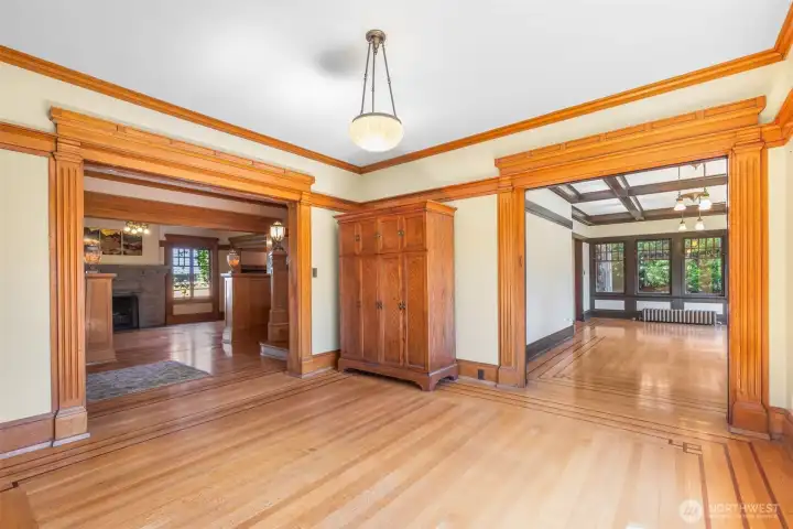 The parlor is a useful space between rooms, but this one is particularly wonderful with great light accenting the golden moulding. Notice from this room you can see both the formal living room and the informal family room which overlooks the gardens on the south side of the property.