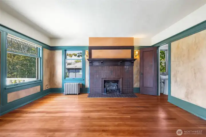 Primary bedroom spans two rooms on the 2nd floor; with a fireplace, attached 1/2 bath, and access to the roof deck, this is a lovely suite.