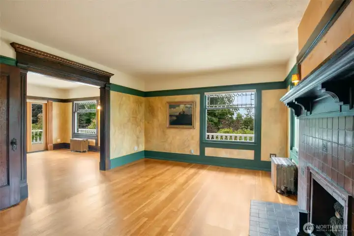 Primary bedroom spans two rooms on the 2nd floor; with a fireplace, attached 1/2 bath, and access to the roof deck, this is a lovely suite.