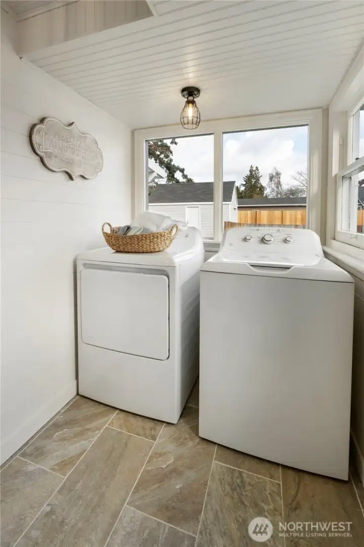 Charming laundry area with new flooring