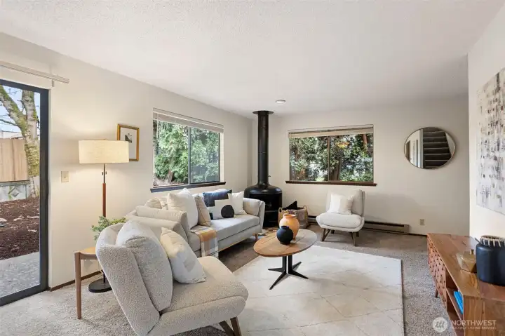 The main floor of Unit 9549 offers a spacious layout with an open kitchen that connects to the living & dining areas with glass doors leading to the backyard.
