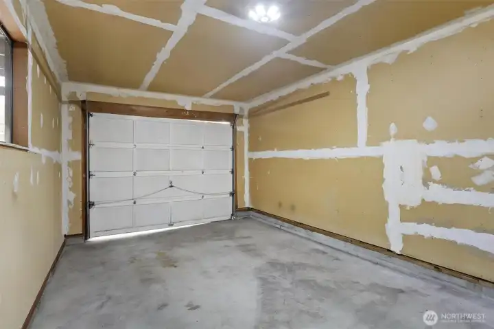 Both 2 bedroom units come with a garage, stylish mid-century fireplace & D/W.