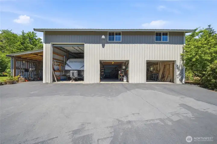 Each bay is 14' wide. The doors measure 12' tall by 10' wide and 7' tall by 8' wide. Each bay is 14' wide. The doors measure 12' tall by 10' wide and 7' tall by 8' wide.