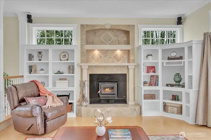 Surrounded by stunning tile and built in shelving the wood burning insert is the perfect final touch to the family room Surrounded by stunning tile and built in shelving the wood burning insert is the perfect final touch to the family room