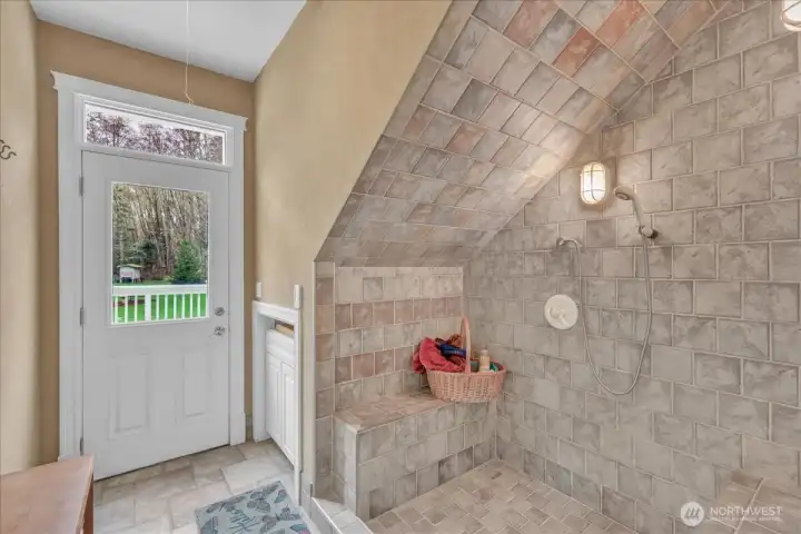 Situated off the back deck is the mud room with heated tile floors and pet shower! Situated off the back deck is the mud room with heated tile floors and pet shower!