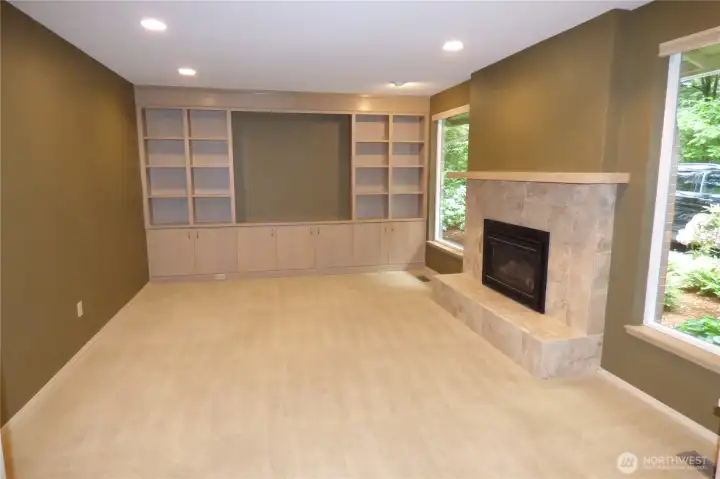 Nice sized living room with custom built ins and gas fireplace. Carpet just cleaned too!