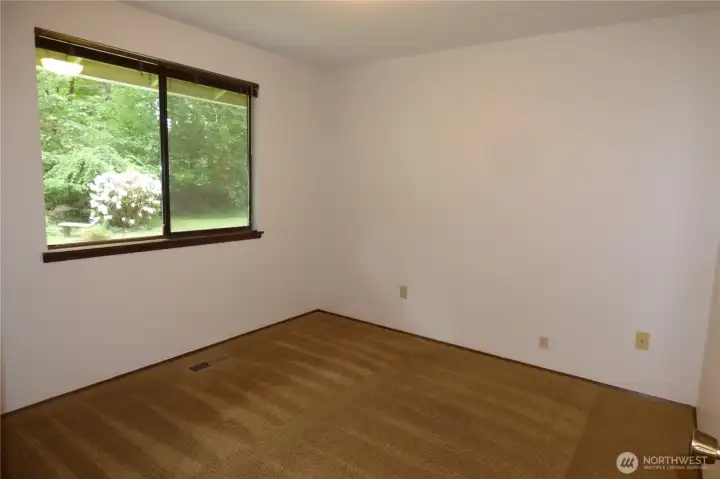 3rd bedroom overlooking the beautiful backyard.