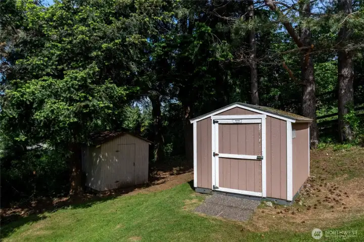 Two sheds towards the back of the property.
