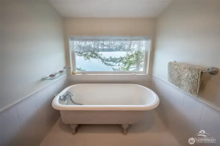 Soaking tub with a view on upper level. Soaking tub with a view on upper level.