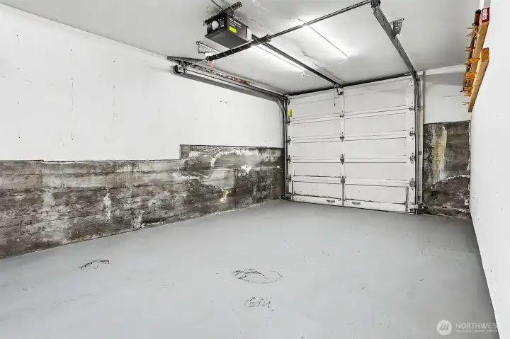 Garage with access into the basement. Garage with access into the basement.