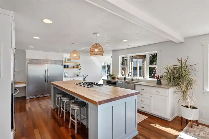 Kitchen with oversized refrigerator.