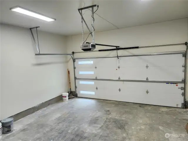 2 car garage with showcase insulated garage door