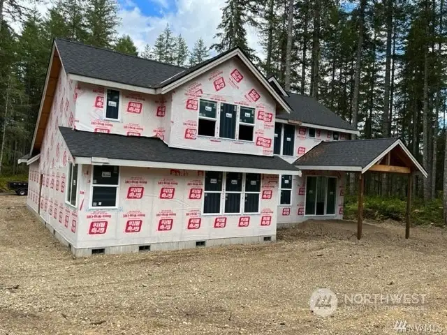 Nw craftsman partially built home on 2 acres surrounded by trees and lakes ready to make your next home