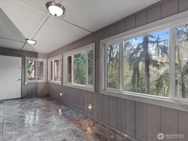 Sun room/mud room to the back yard