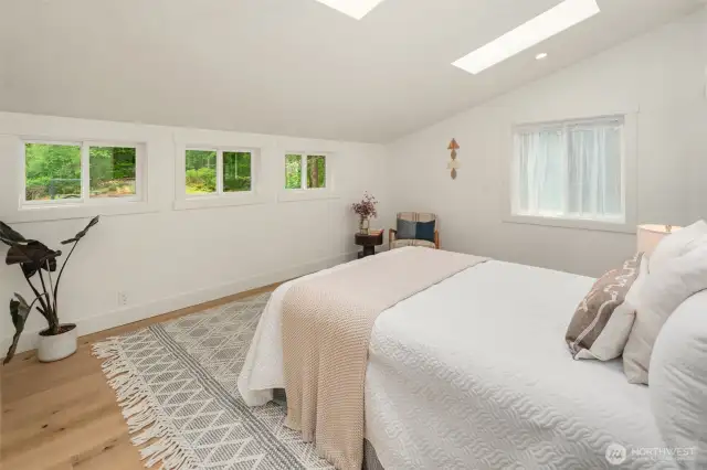 Skylights and windows bring great light into the primary room