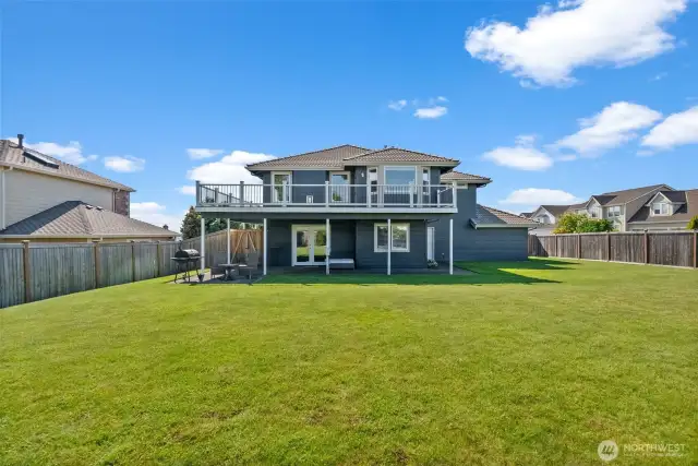 The deck wraps around with views from every angle. The yard is so level and perfect for playing and enjoying