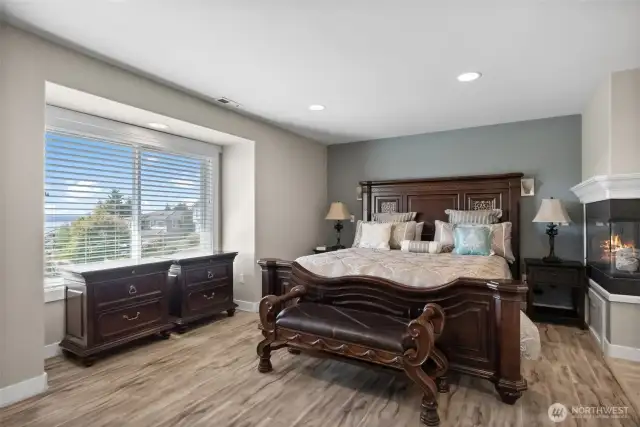 Primary bedroom on the main floor with water view.