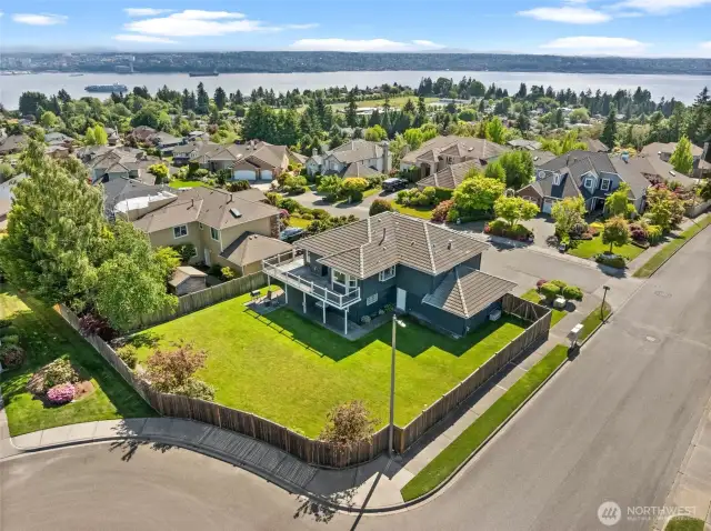 This home sits up high on a private, corner lot with views from every angle