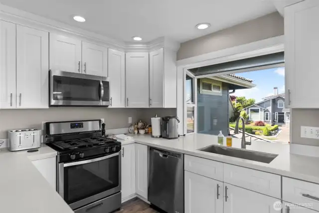 Gas range, farm sink, quartz counters