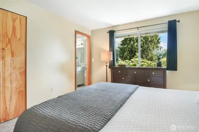 The primary bedroom offers an attached bathroom and walk-in closet.