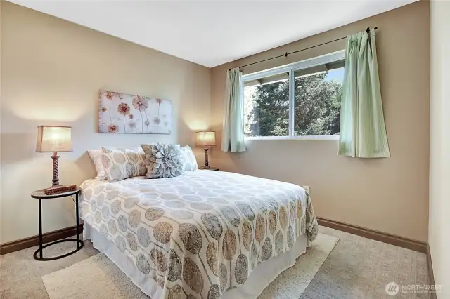 Another of the bedrooms upstairs. There are 4 in total, including the primary.