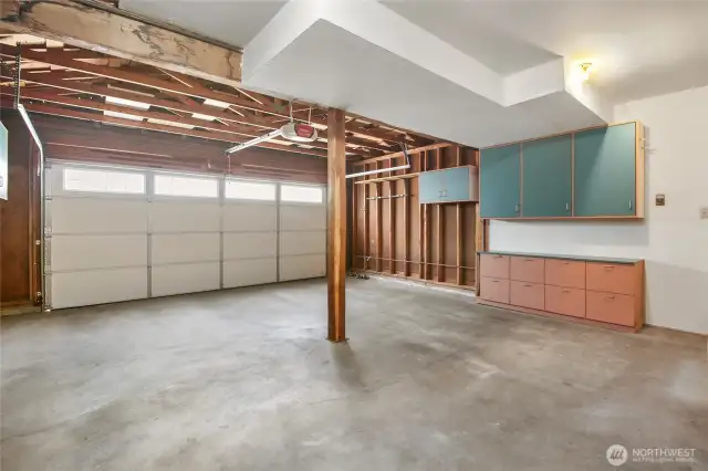 The garage also offers cabinetry for storage.