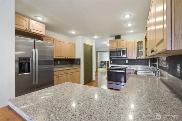 Kitchen has no shortage of counter-space. Also has a pantry seen here.