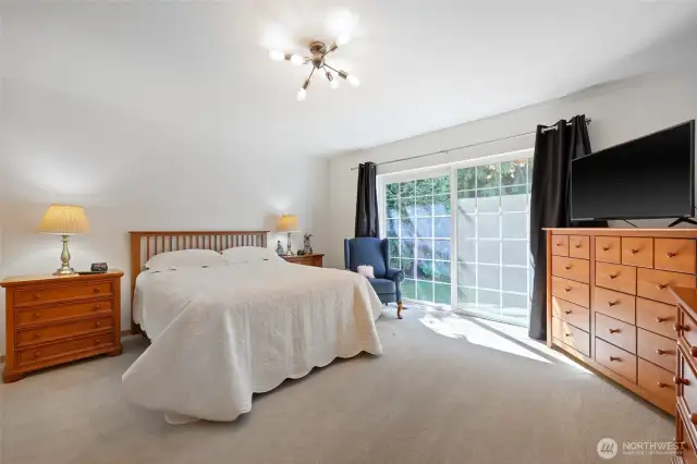 Primary bedroom with private sliding glass door leading to you own patio and hot tub out back.