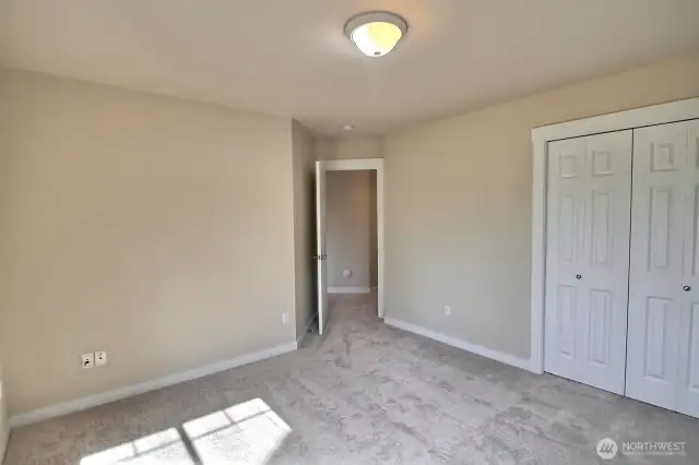 Another view of this front bedroom showing the entry and closet space.
